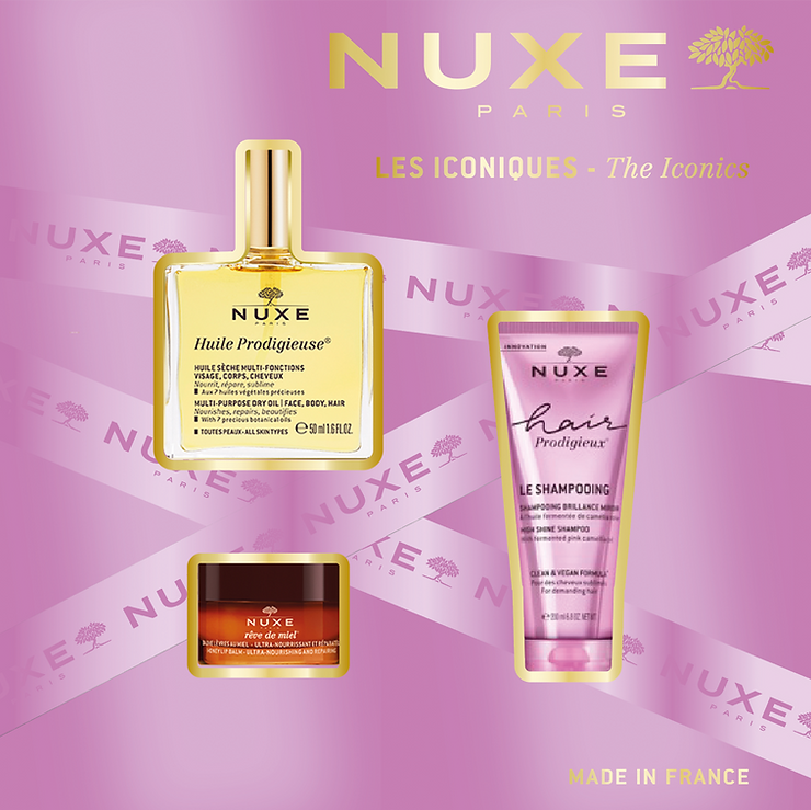 Drei NUXE Paris Kosmetikprodukte vor rosa Hintergrund mit goldfarbenem Schriftzug